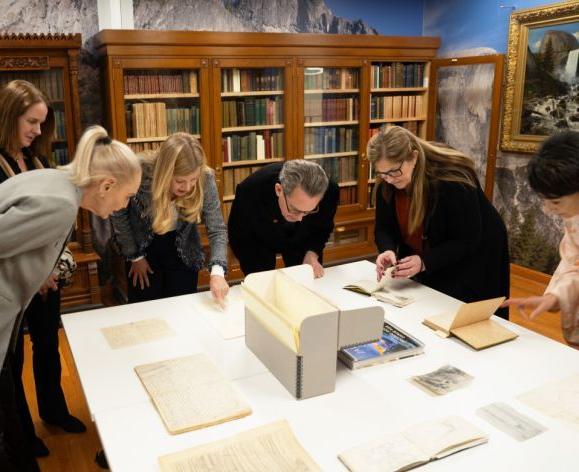 regents look at materials from the library's john muir collection