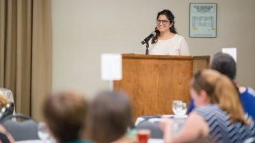 Pacific alumna Marukh Hasan speaking at an event