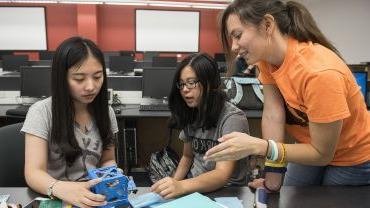 Students building a device